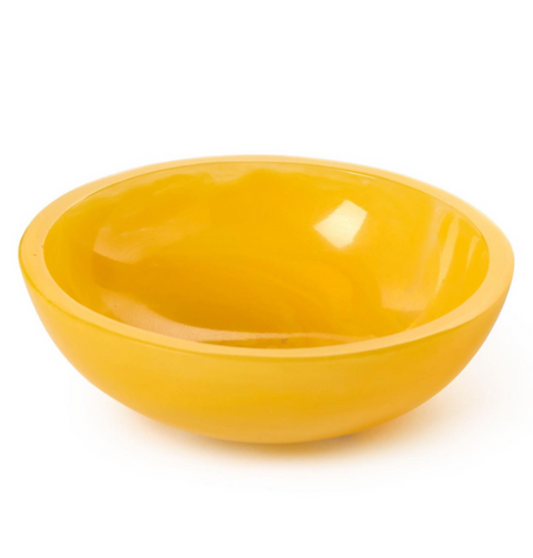 Yellow ceramic bowl on a white background
