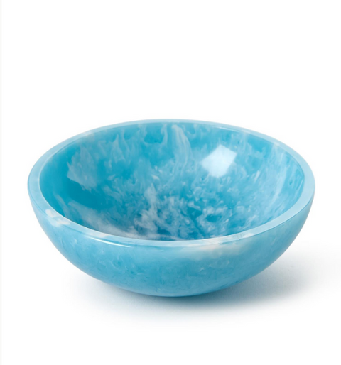 Blue ceramic bowl with marbled pattern on a white background