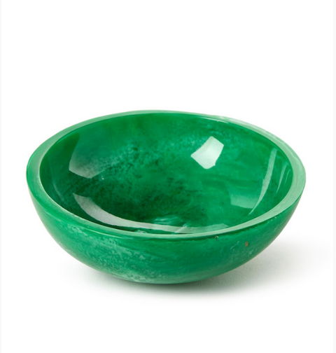 Green ceramic bowl on a white background