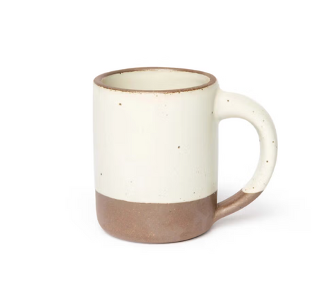 Ceramic mug with a two-tone design on a white background