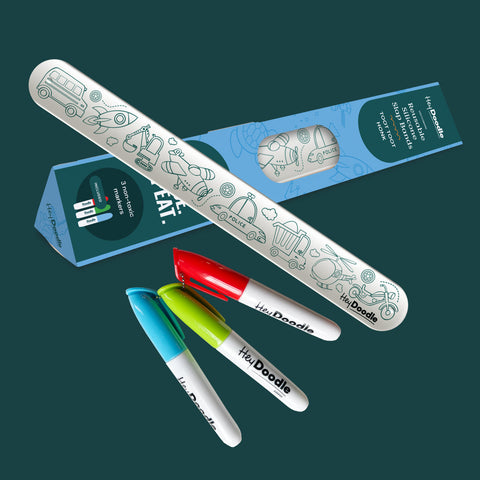 Colorful markers with a bracelet and packaging on a dark green background