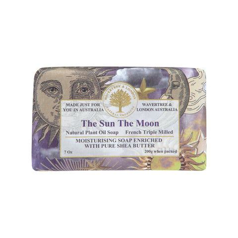 Soap bar with decorative packaging featuring sun and moon designs on a white background.