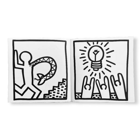 Open book showing black and white illustrations of a person with a dog and hands holding a light bulb.
