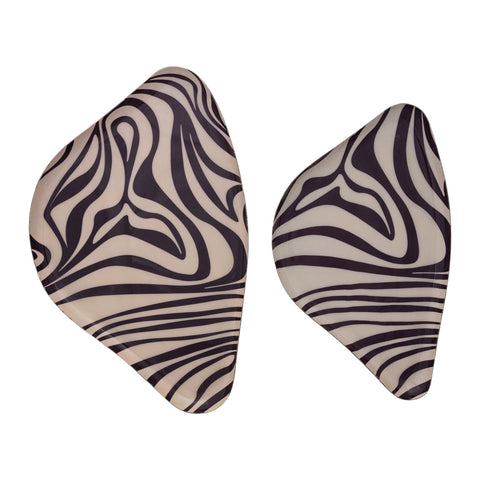 Pair of zebra patterned earrings on a white background