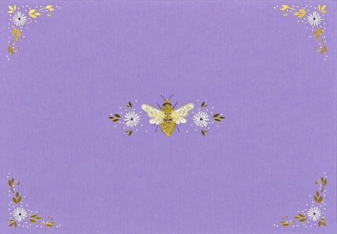 Decorative purple fabric with embroidered bee and floral patterns