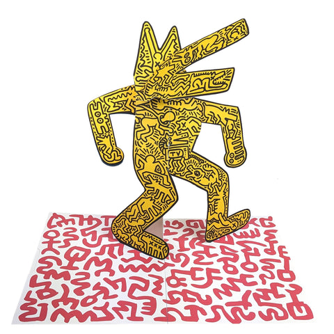 Yellow abstract figure on a white background with red patterned base