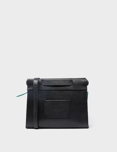 Black leather crossbody bag on a light gray background