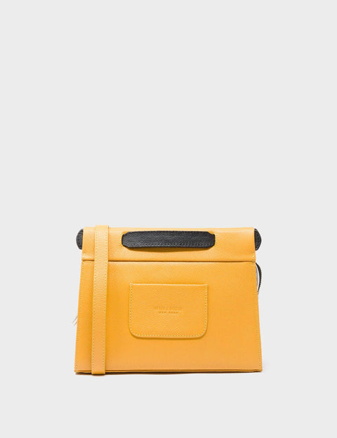 Yellow leather wallet with black accents on a light gray background