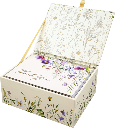 Floral design greeting card set in a matching box on a white background
