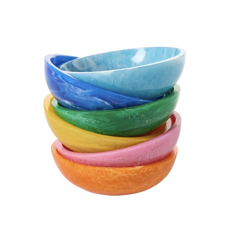 Stack of colorful ceramic bowls on a white background