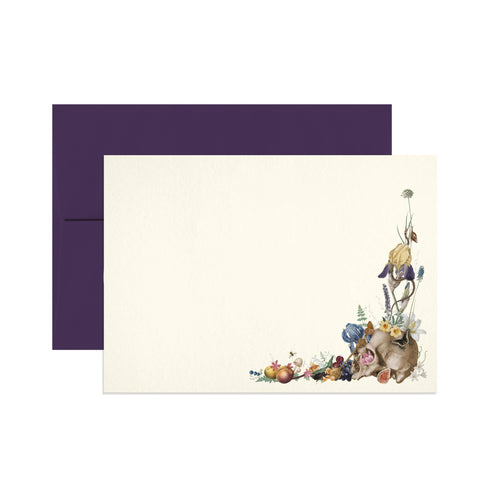 Note card with illustration of a skull surrounded by flowers, purple envelope.