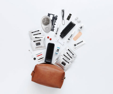 Emergency kit with various grooming items on a white background