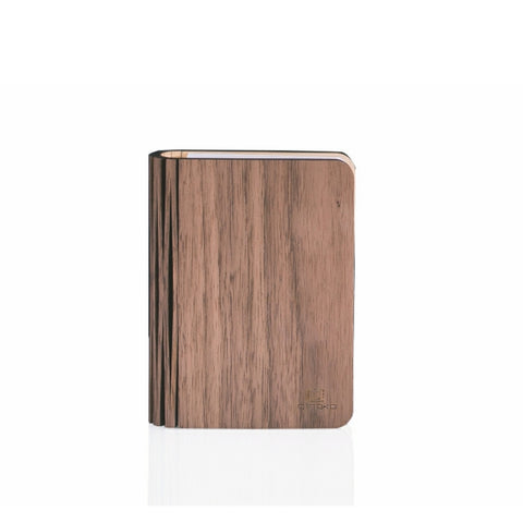 Wooden book shape lamp on a white background