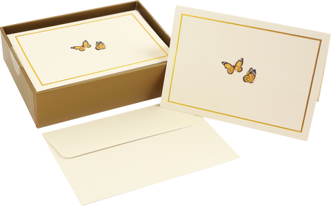 Set of stationery with butterfly designs on a white background