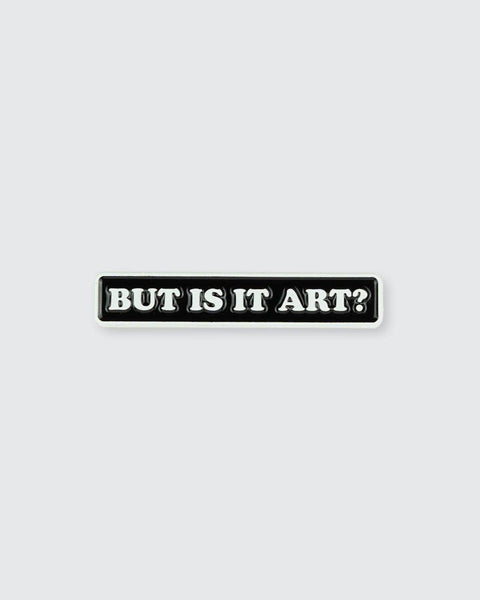 A pin with 'BUT IS IT ART?' text on a white background