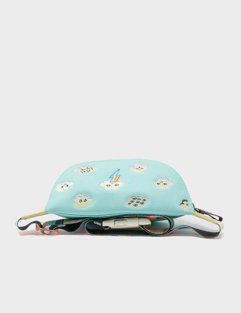 Light blue fanny pack with cartoon designs on a white background