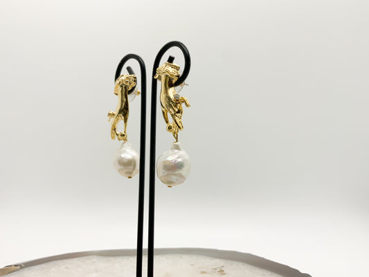 Hand Holding Baroque Pearl Earring