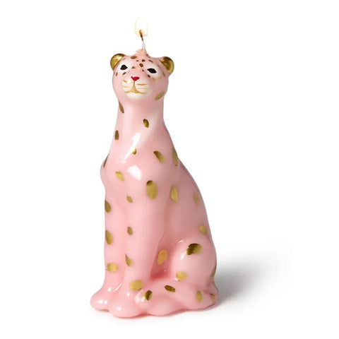 Pink candle shaped like a leopard  with gold spots on a white background